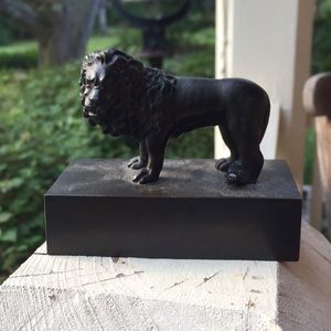 Regal lion bronze figurine